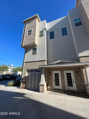 a front view of a house with a garage