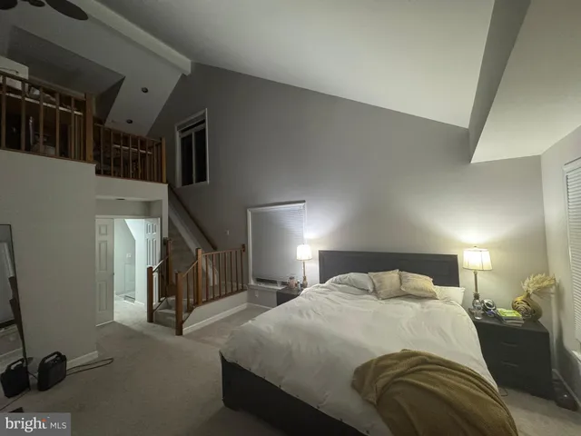 a bed room with a bed and a lamp