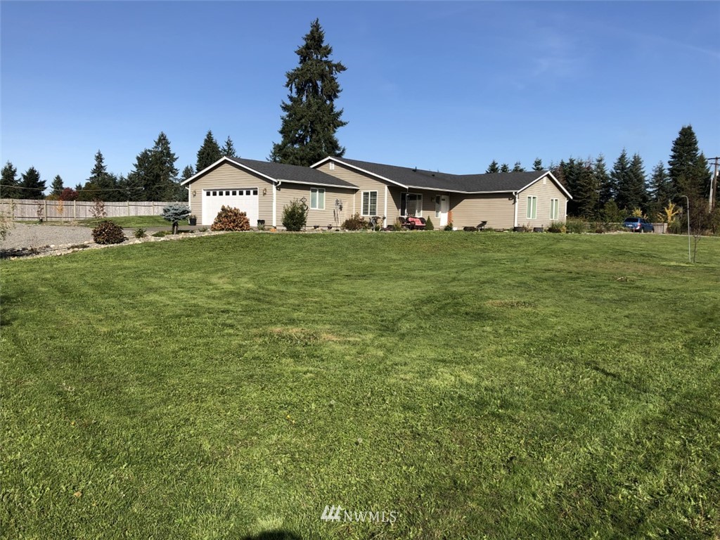 9222 176th Avenue Southwest Rochester, WA 98579 - Photo 1 of 21 a front view of a house with garden