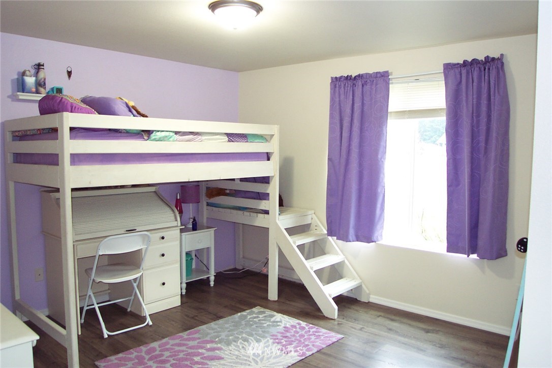 9222 176th Avenue Southwest Rochester, WA 98579 - Photo 14 of 21 a bedroom with a bed and a window