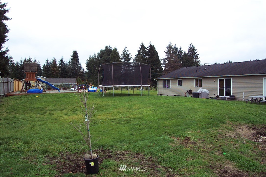 9222 176th Avenue Southwest Rochester, WA 98579 - Photo 17 of 21 a view of a house with a yard porch and sitting area