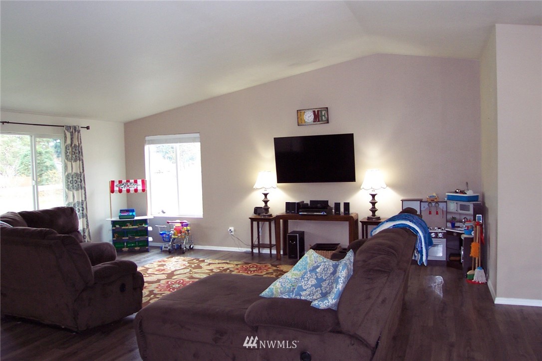 9222 176th Avenue Southwest Rochester, WA 98579 - Photo 3 of 21 a living room with furniture and a flat screen tv