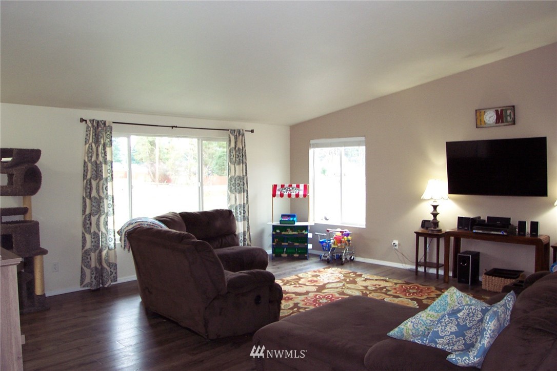 9222 176th Avenue Southwest Rochester, WA 98579 - Photo 4 of 21 a living room with furniture and a flat screen tv