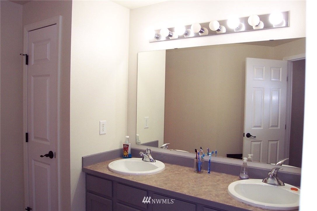 9222 176th Avenue Southwest Rochester, WA 98579 - Photo 9 of 21 a bathroom with a sink and a mirror