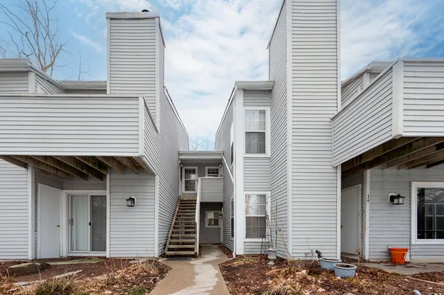 a front view of a house with garage