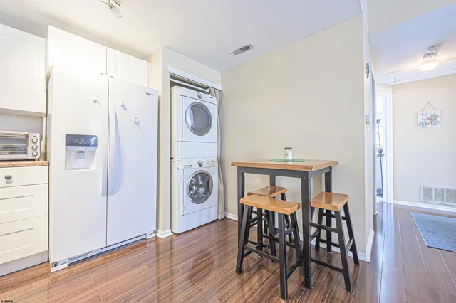 a bathroom with a sink a toilet and shower curtain