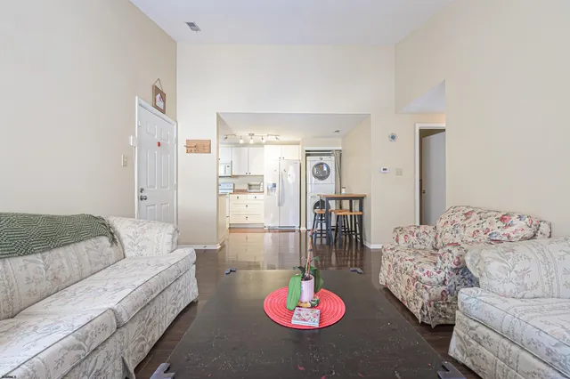 a living room with furniture and a table