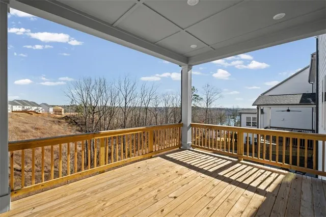 a view of a balcony with wooden floor