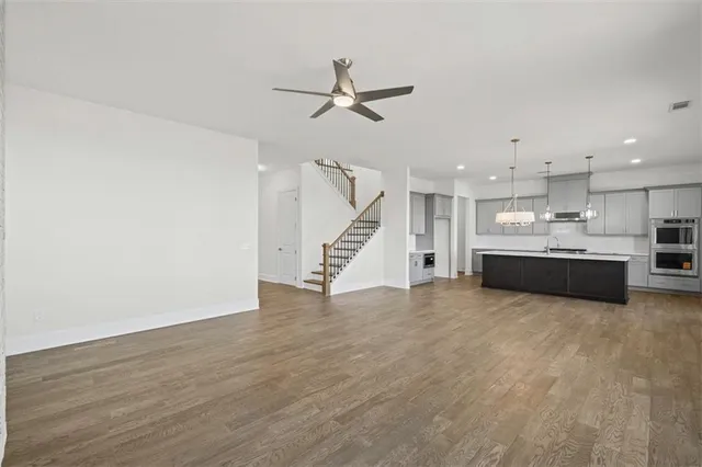 a view of kitchen with refrigerator and window