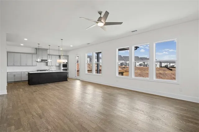 a view of kitchen and window with wooden floor