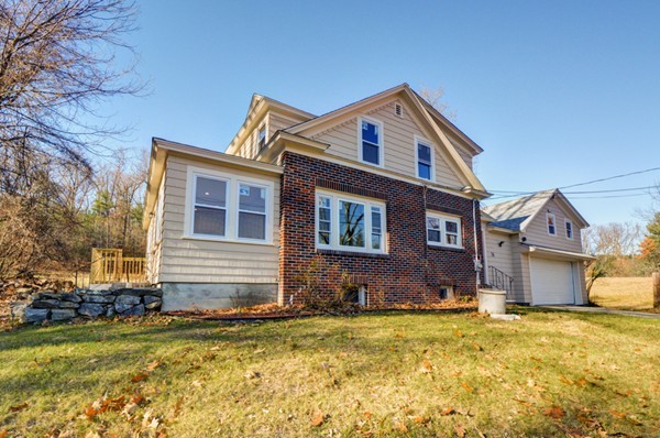 56 Bryant Road Holden, MA 01522 - Photo 1 of 24 a front view of a house with a yard