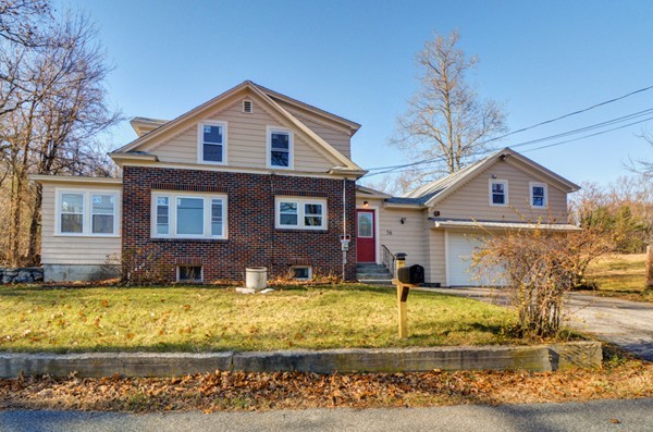 56 Bryant Road Holden, MA 01522 - Photo 2 of 24 a front view of a house with a yard