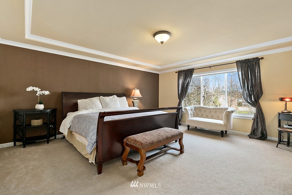 16204 40th Avenue Southeast Bothell, WA 98012 - Photo 13 of 24 a bedroom with a bed and a couch