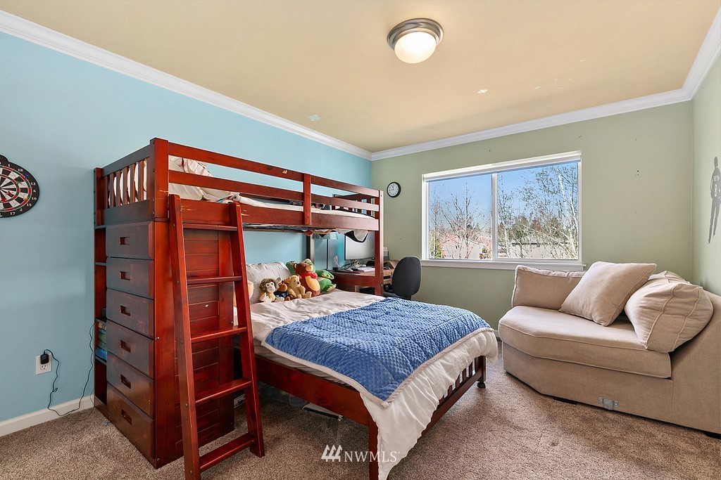 16204 40th Avenue Southeast Bothell, WA 98012 - Photo 17 of 24 a bed room with a bed and a couch
