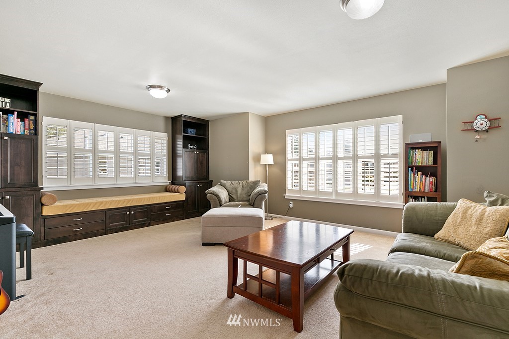 16204 40th Avenue Southeast Bothell, WA 98012 - Photo 18 of 24 a living room with furniture and a large window