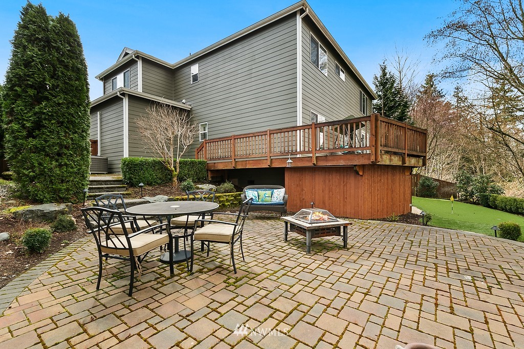 16204 40th Avenue Southeast Bothell, WA 98012 - Photo 23 of 24 a backyard of a house with table and chairs