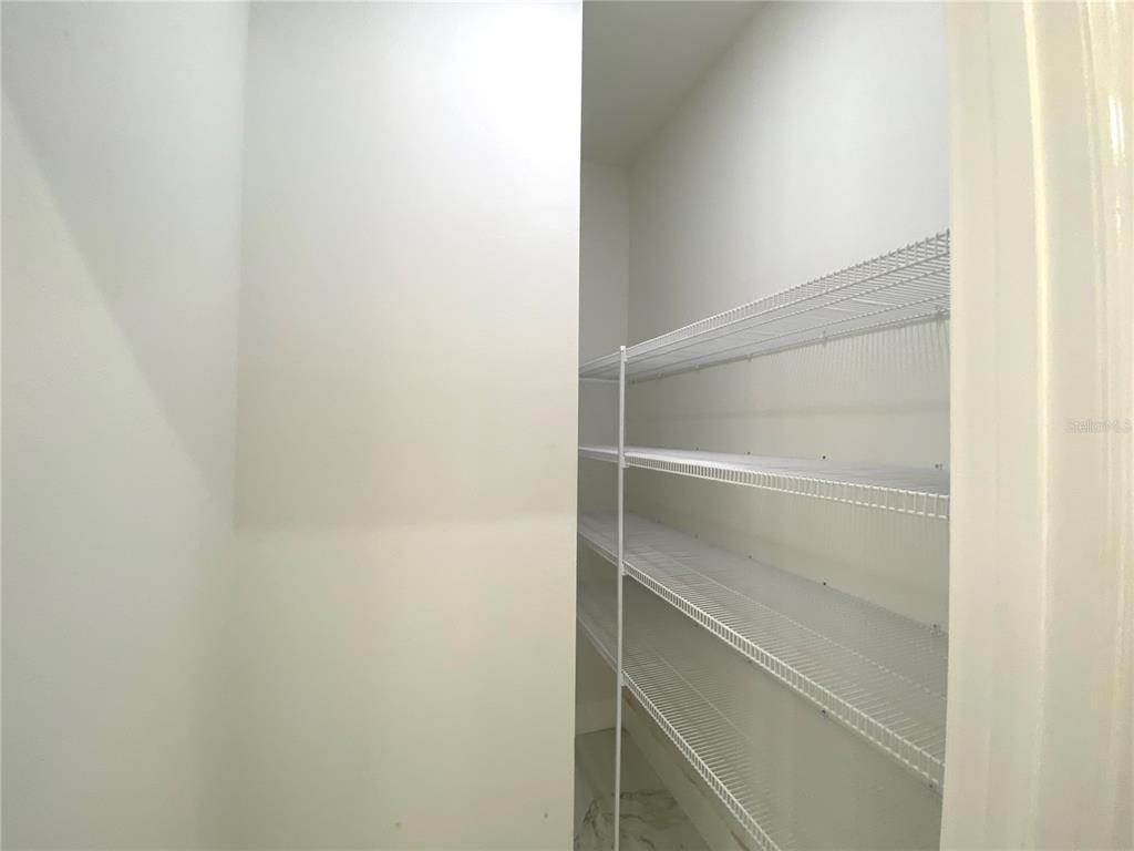 4449 Schumacher Road Sebring, FL 33872 - Photo 14 of 32 a view of walk in closet with empty racks