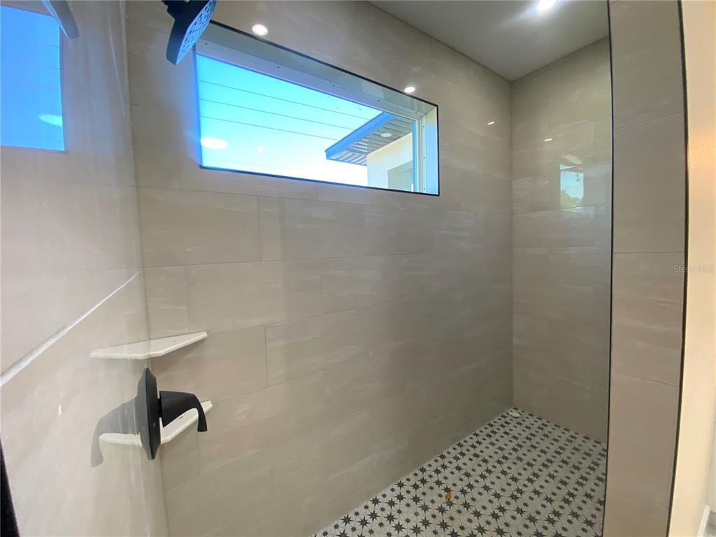 4449 Schumacher Road Sebring, FL 33872 - Photo 18 of 32 a bathroom with a shower