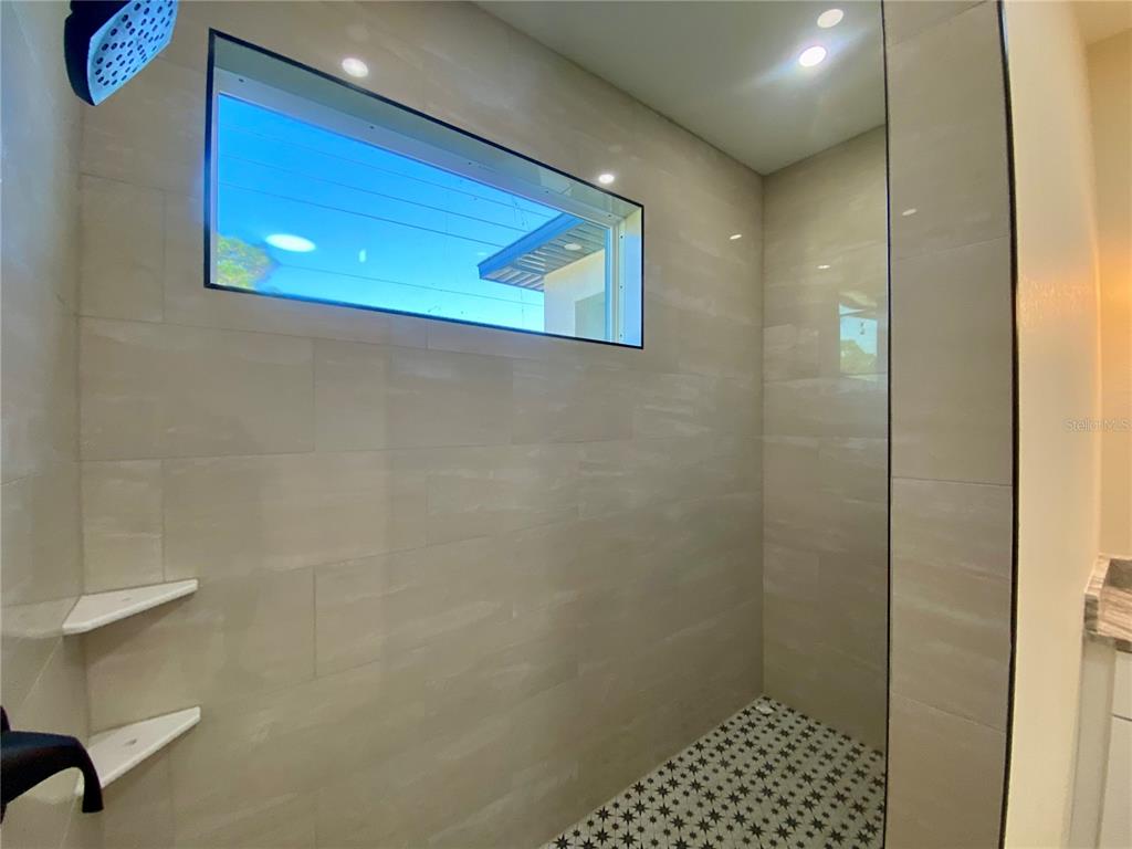 4449 Schumacher Road Sebring, FL 33872 - Photo 19 of 32 a bathroom with a shower