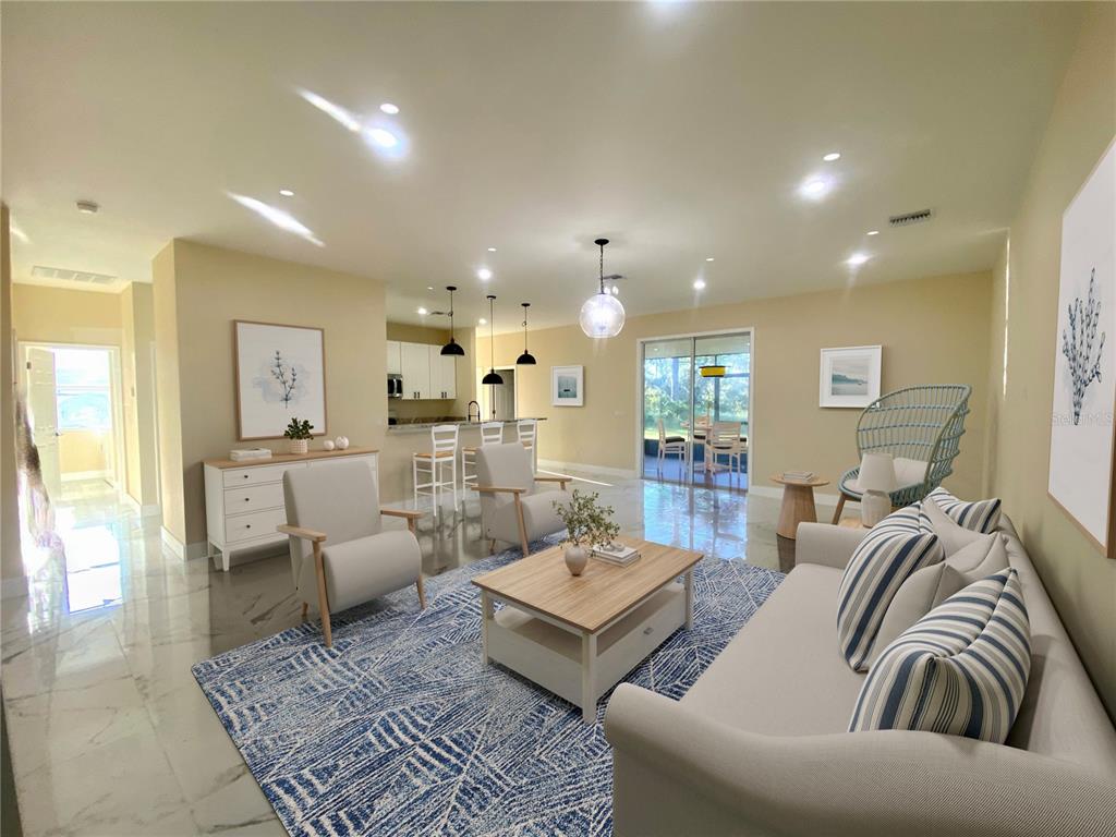 4449 Schumacher Road Sebring, FL 33872 - Photo 6 of 32 a living room with furniture and wooden floor