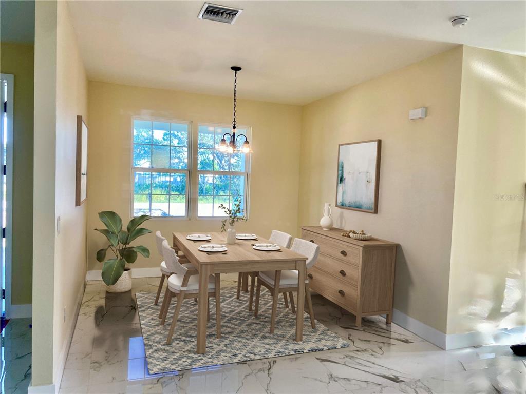 4449 Schumacher Road Sebring, FL 33872 - Photo 9 of 32 a dining room with a table or chairs and a wooden floor