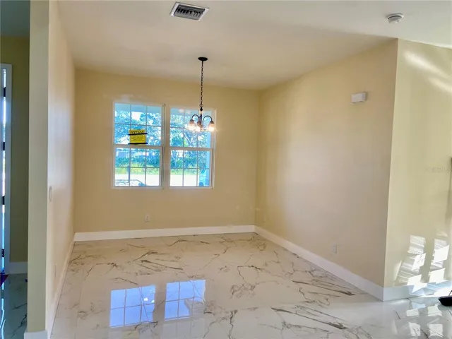 a view of an empty room and window