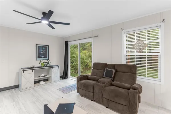 a living room with furniture and a window