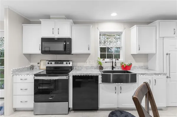 a kitchen with a stove and a microwave