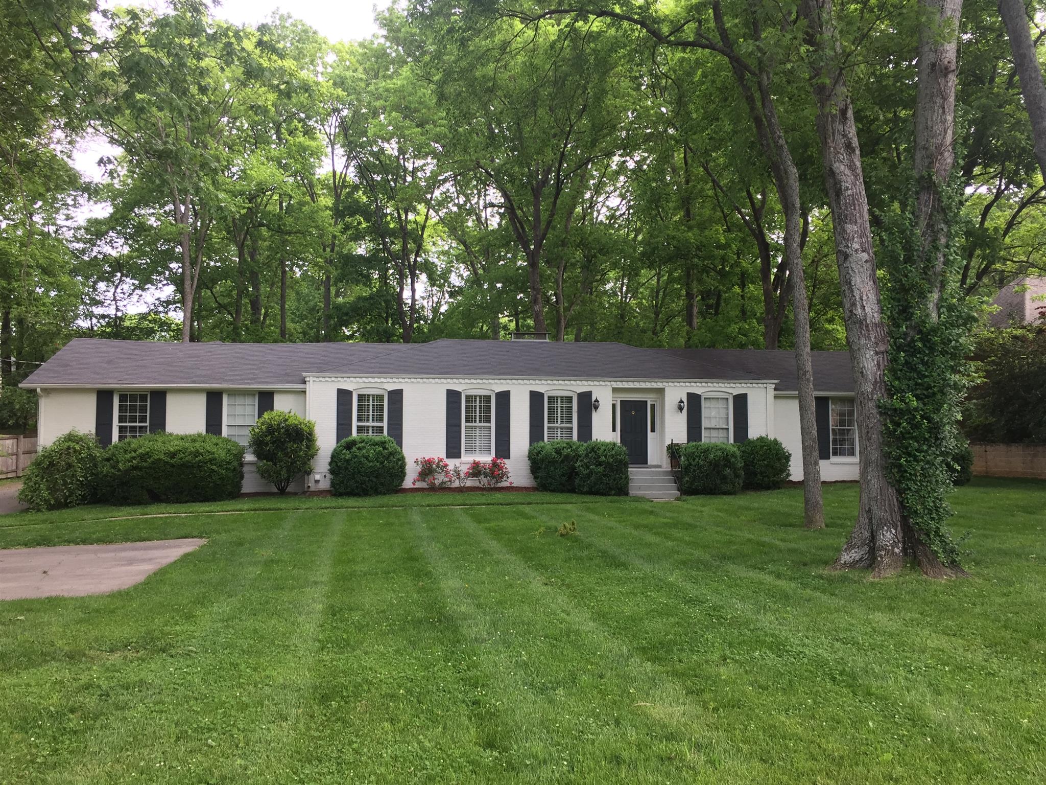 3710 Trimble Road Nashville, TN 37215 - Photo 1 of 1 a view of a house next to a big yard and large trees