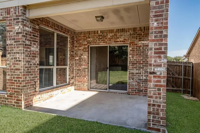 a view of house with backyard