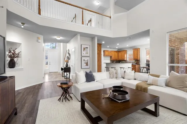 a living room with furniture or couch and a wooden floor