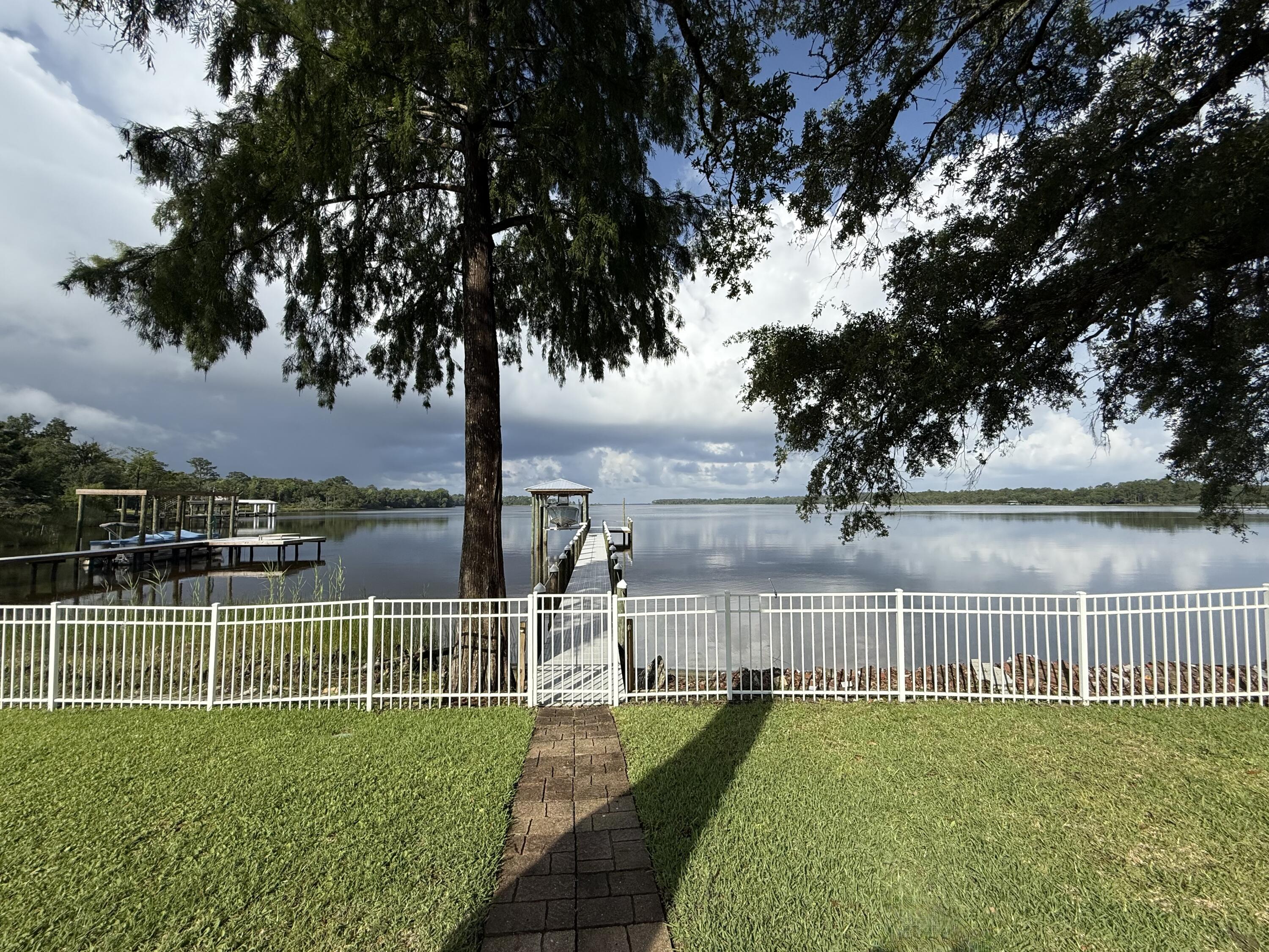 24 Waterview Place Freeport, FL 32439 - Photo 6 of 53 walking out of screened-in porch