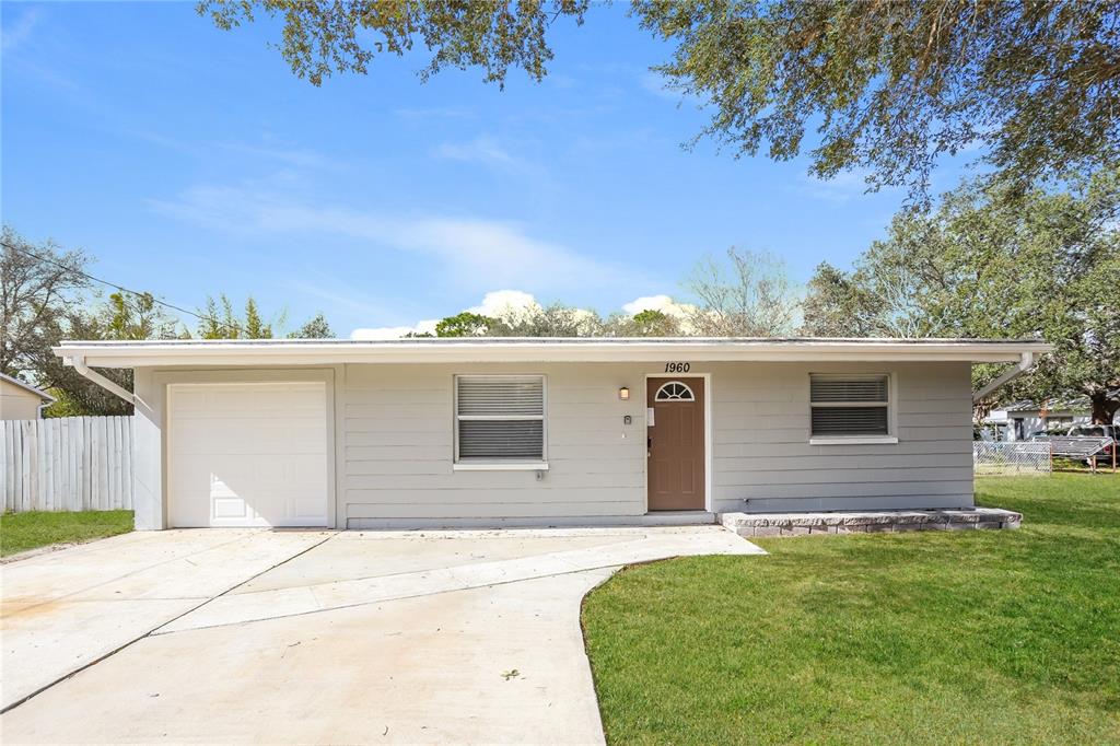 1960 Cecil Street Largo, FL 33774 - Photo 1 of 16 a view of a house with a backyard