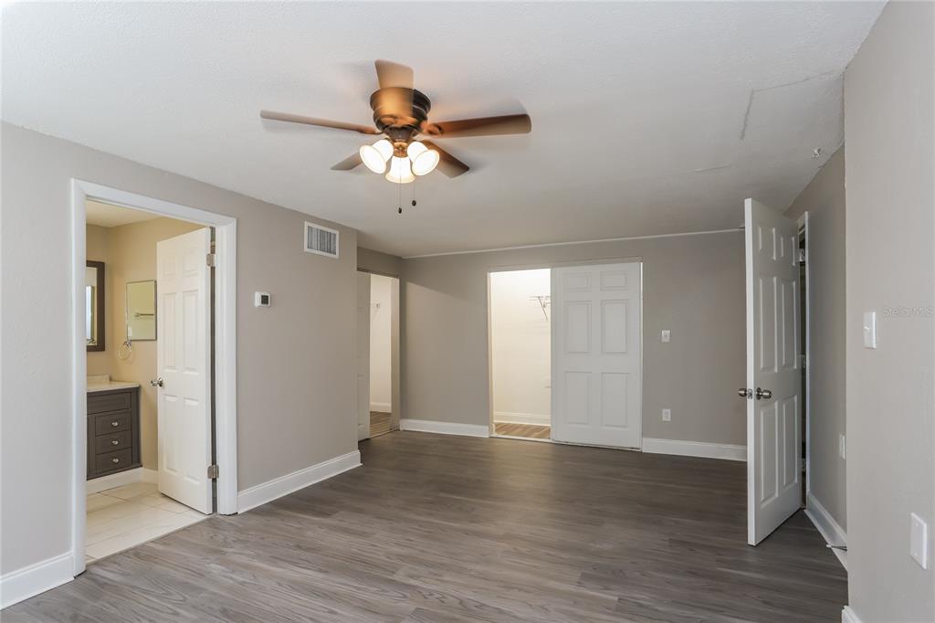 1960 Cecil Street Largo, FL 33774 - Photo 8 of 16 a view of an empty room with wooden floor