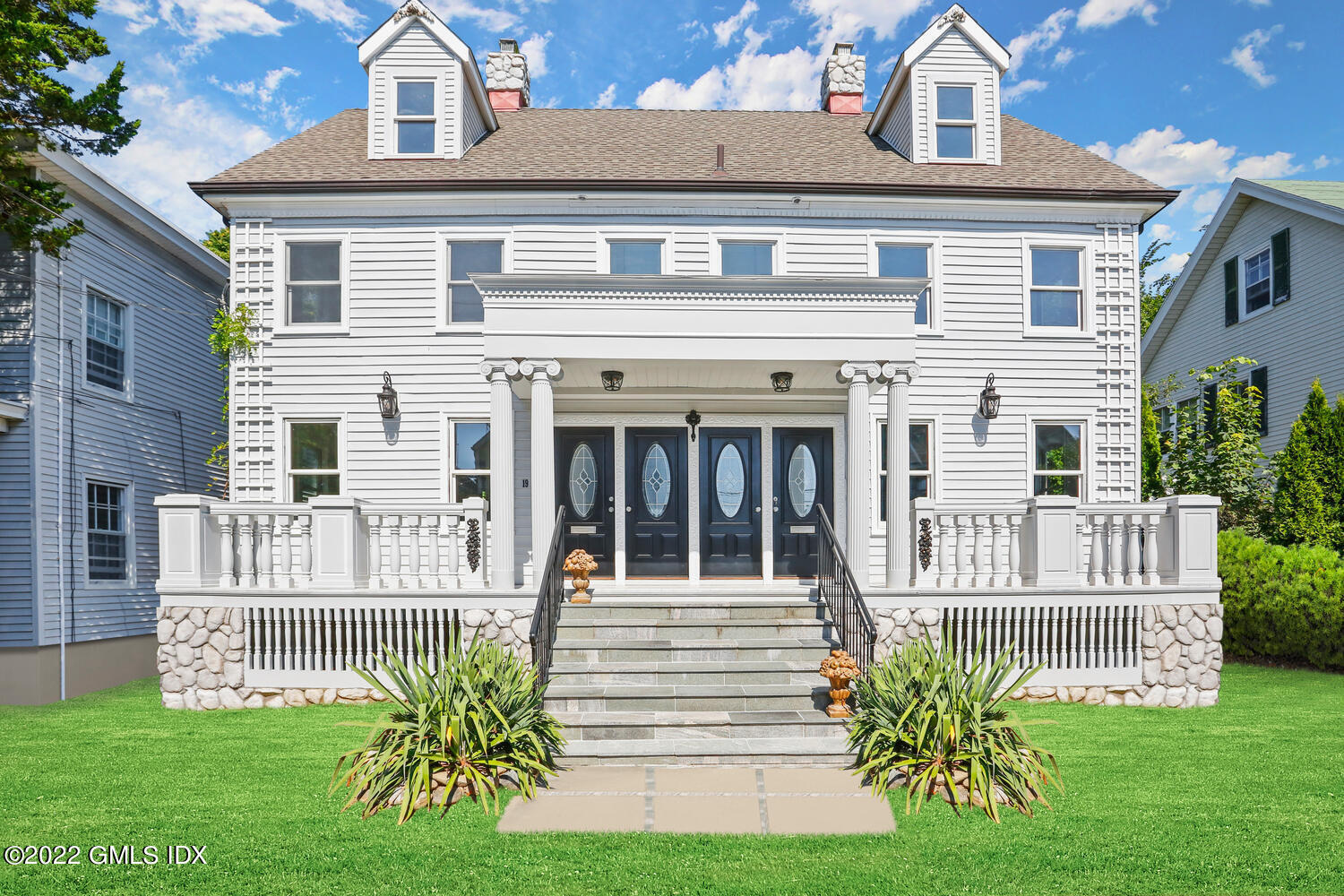 19 Division Street, Unit 19 Greenwich, CT 06830 - Photo 1 of 15 front view of a house with a yard