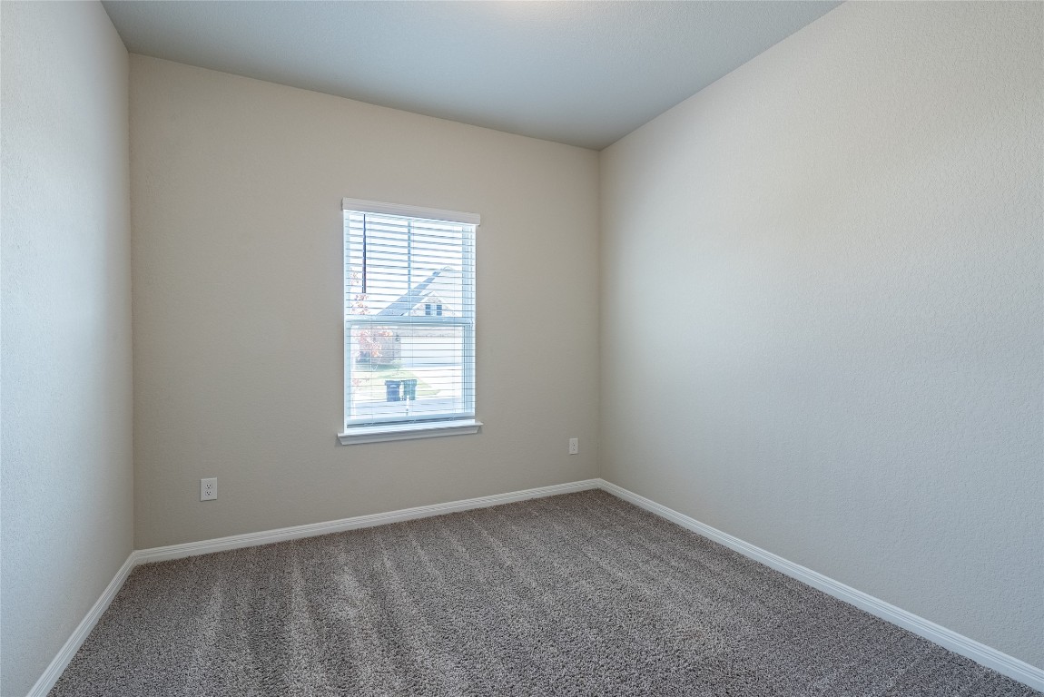 107 Cona Way Hutto, TX 78634 - Photo 7 of 26 Spare room with carpet floors and baseboards