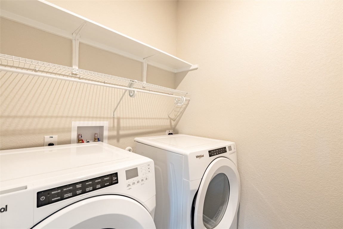 107 Cona Way Hutto, TX 78634 - Photo 10 of 26 Washroom featuring washer and dryer