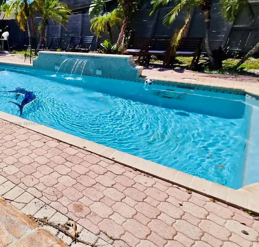 a view of swimming pool from a window