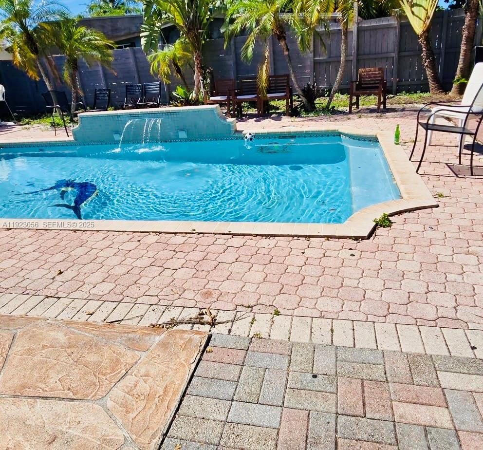1773 Northeast 50th Street Pompano Beach, FL 33064 - Photo 3 of 7 a view of yard with patio