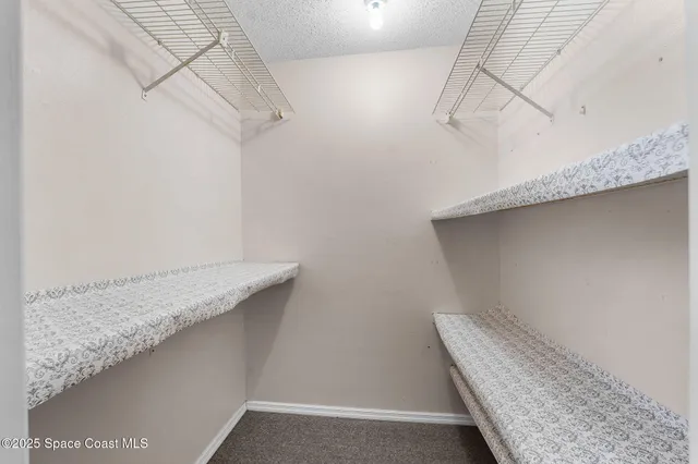 a view of a room with racks on the wall