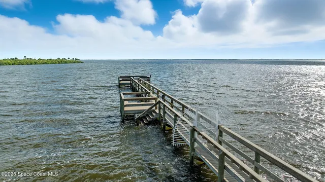 an aerial view of a house with a garden
