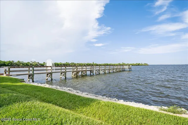 a view of yard with swimming pool and seating area