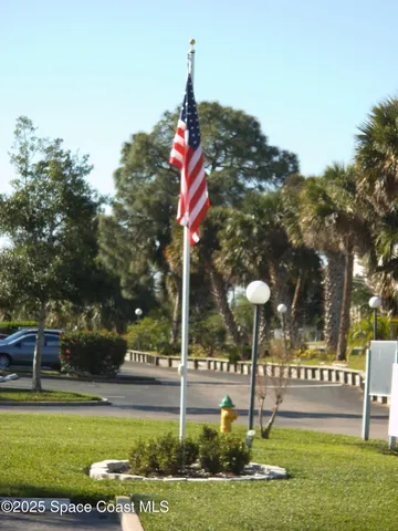 a sign that is on a wall next to a building