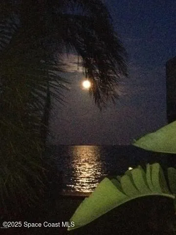 a view of a balcony with two chairs