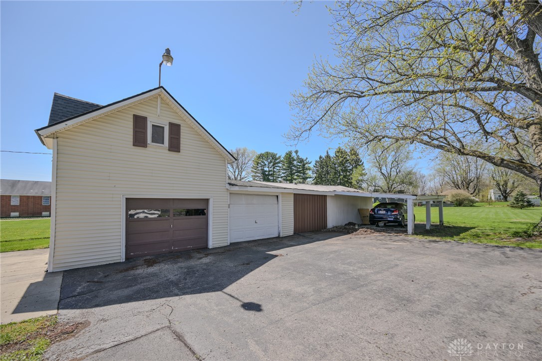 3057 Springfield Xenia Road Springfield, OH 45506 - Photo 31 of 37 This property features multiple garages and a carport, providing ample parking and storage options.