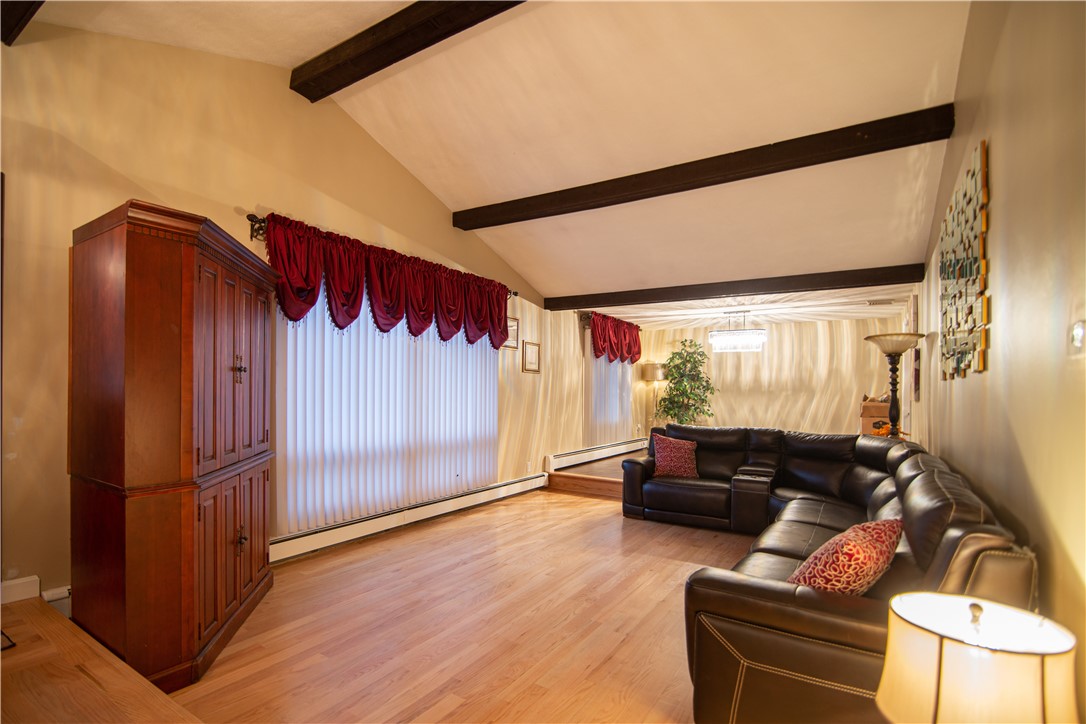 28 Greenbrier Road Smithfield, RI 02828 - Photo 3 of 14 Sunken living room with vaulted ceiling