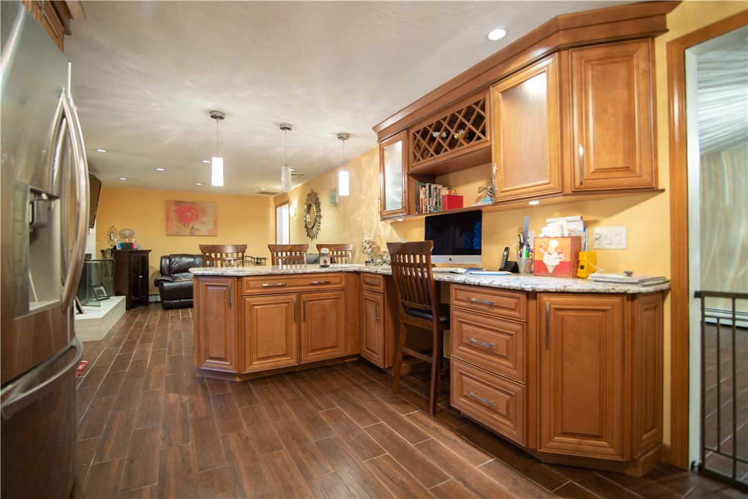 28 Greenbrier Road Smithfield, RI 02828 - Photo 6 of 14 Beautifully updated kitchen with stainless appliances and granite counters.