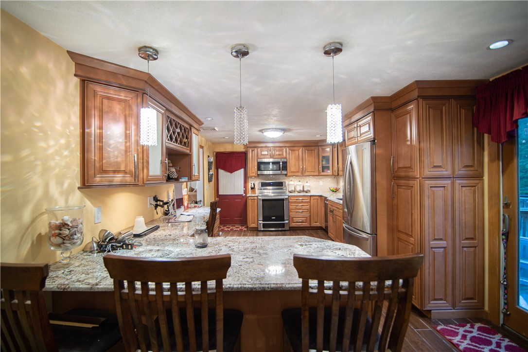 28 Greenbrier Road Smithfield, RI 02828 - Photo 8 of 14 Beautifully updated kitchen with stainless appliances and granite counters.