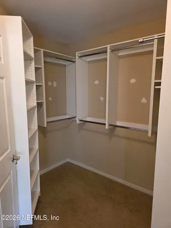 a bathroom with a sink toilet and mirror