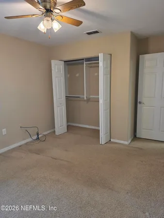 a bathroom with a door and a glass door